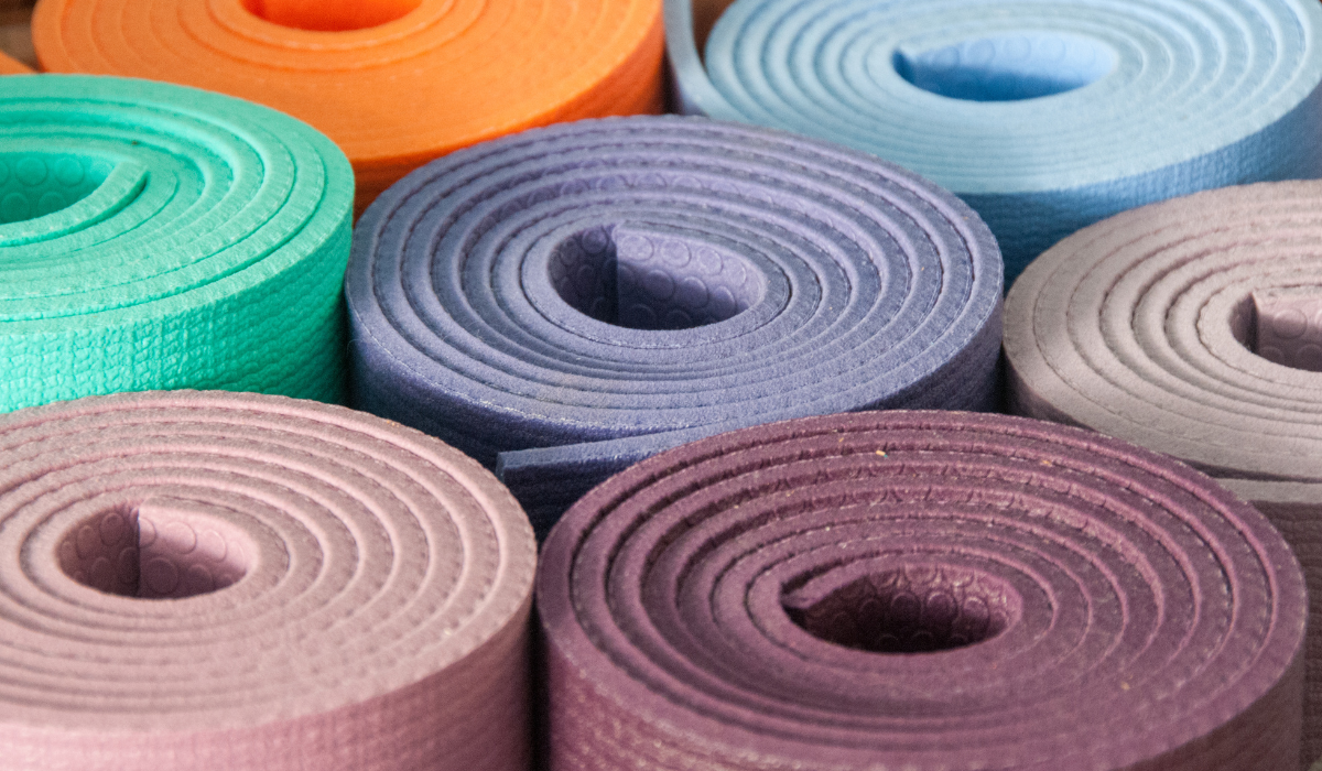 Different color yoga mats of different thicknesses