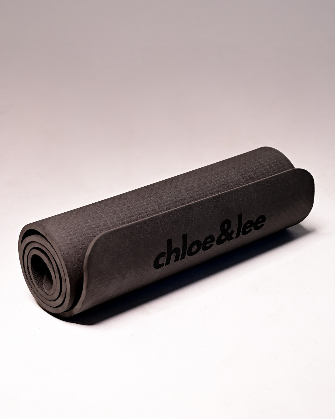 Thick black yoga mat for hot yoga, yoga and pilates