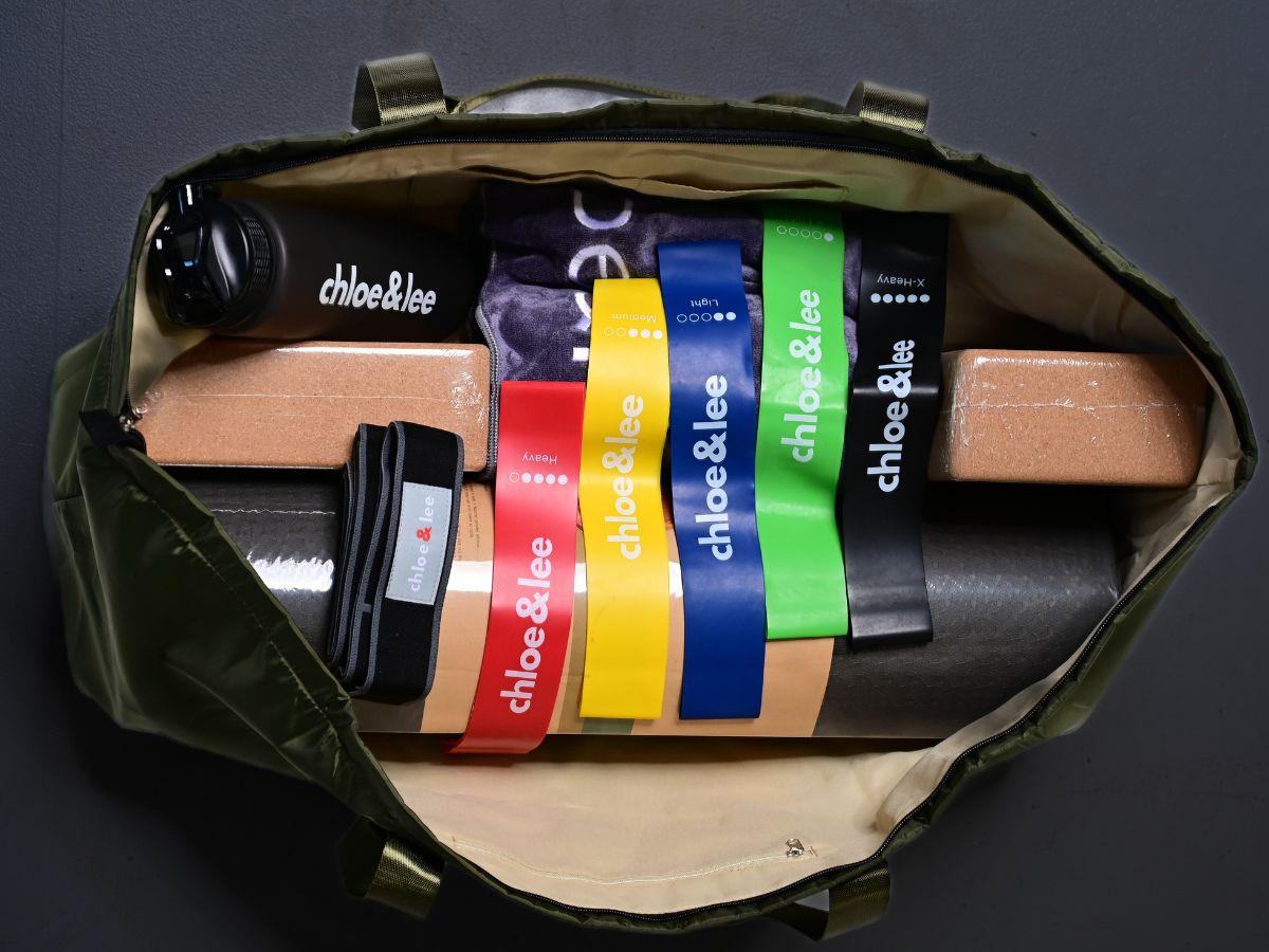 A yoga bag filled with all yoga, pilates and hot yoga fitness essentials. It has a yoga mat,, water bottle and cork yoga blocks all in one